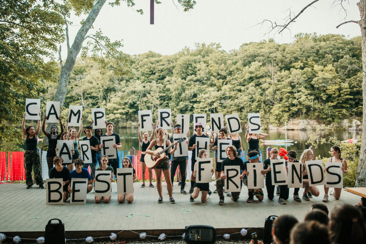 kids-holding-up-letter-signs-at-camp.jpg