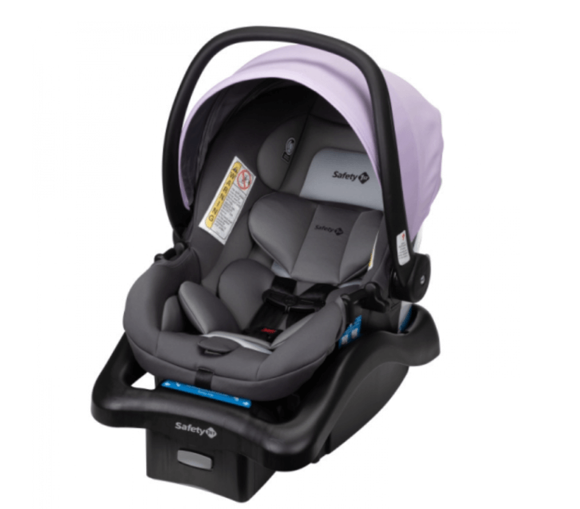 A gray infant car seat with a light lavender canopy and black base, featuring padded straps and Safety 1st branding.