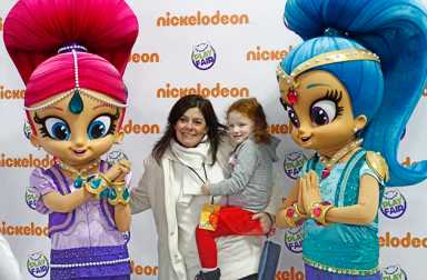 mom-with-young-daughter-at-play-fair-posing-with-shimmer-and-shine